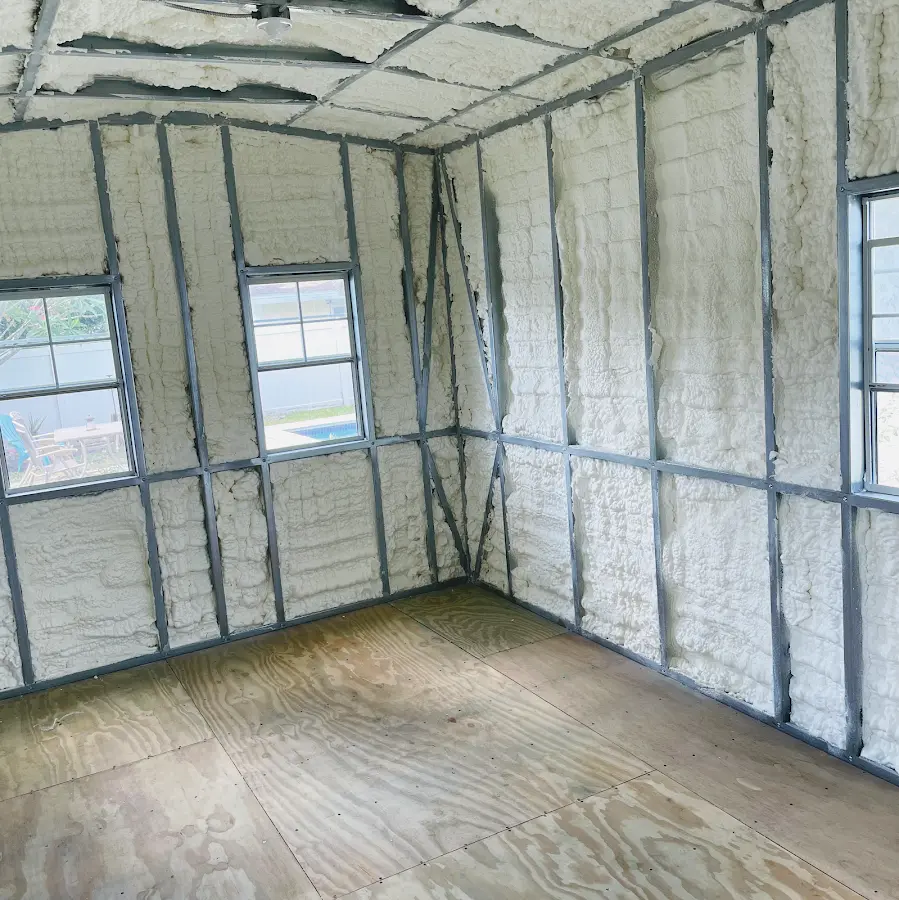Closed-cell spray foam insulation applied to wall cavities in a residential project in Scarsdale